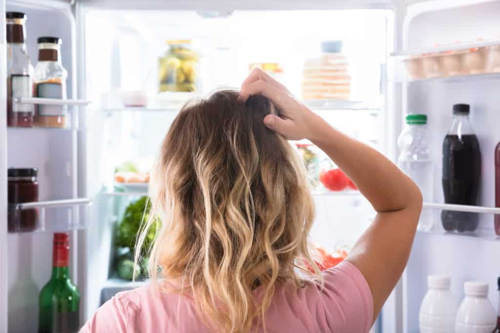 woman scratching her head wondering what's for dinner