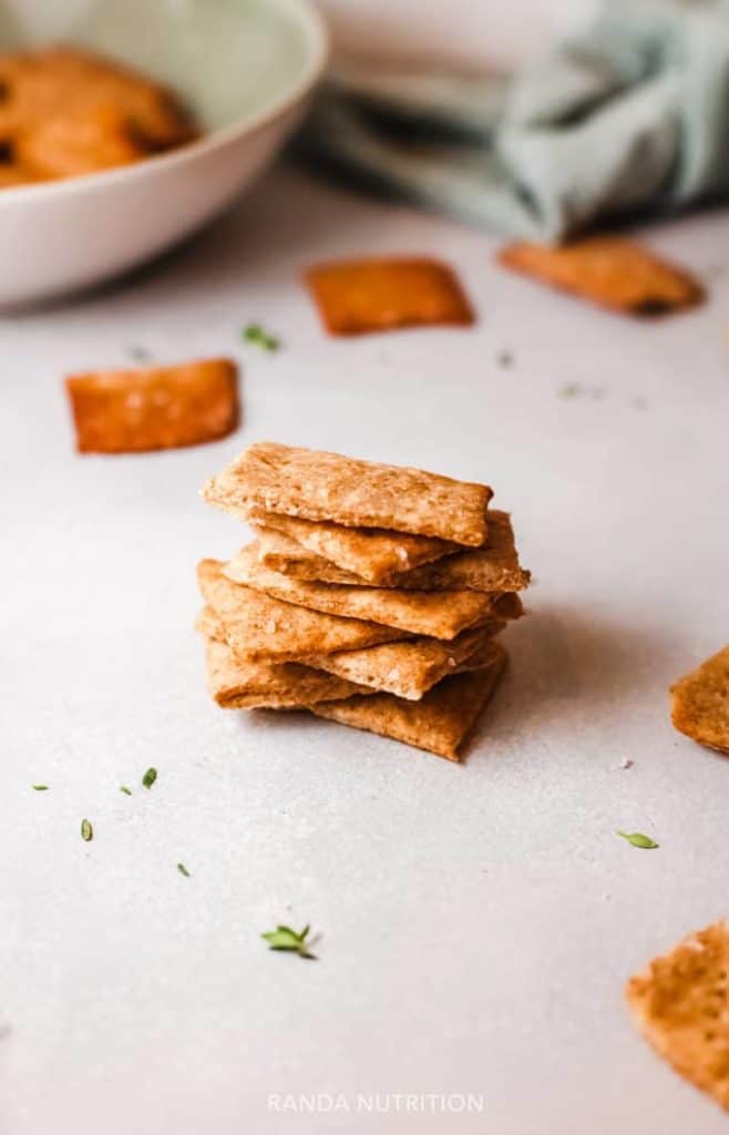 homemade quinoa crackers stacked for snacking