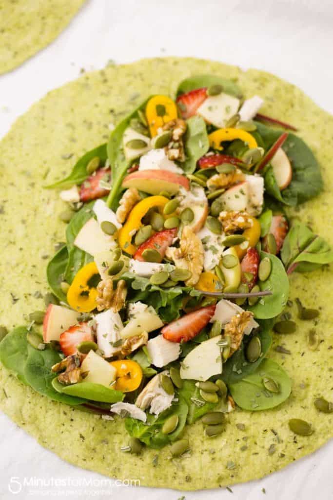 grilled chicken wrap with strawberries, pepitas, shredded chicken and more