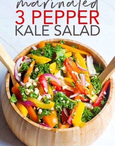 A wooden bowl with marinated three pepper kale salad