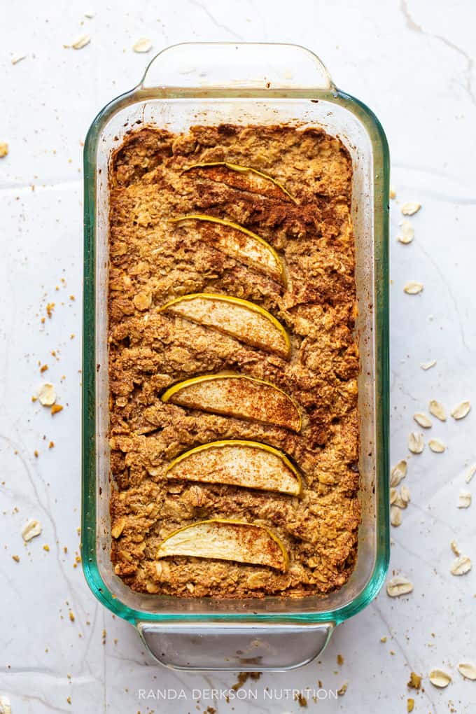 apple oat bread in a glass loaf pan