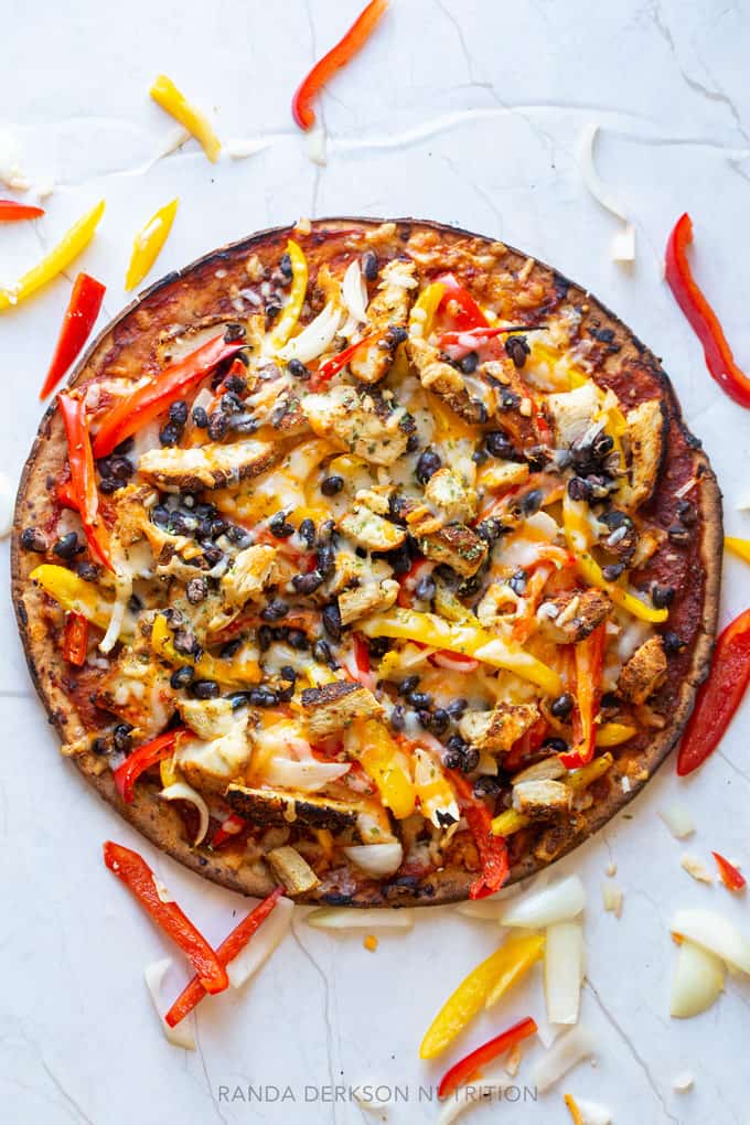 fresh out of the oven fajita chicken pizza with peppers and black beans