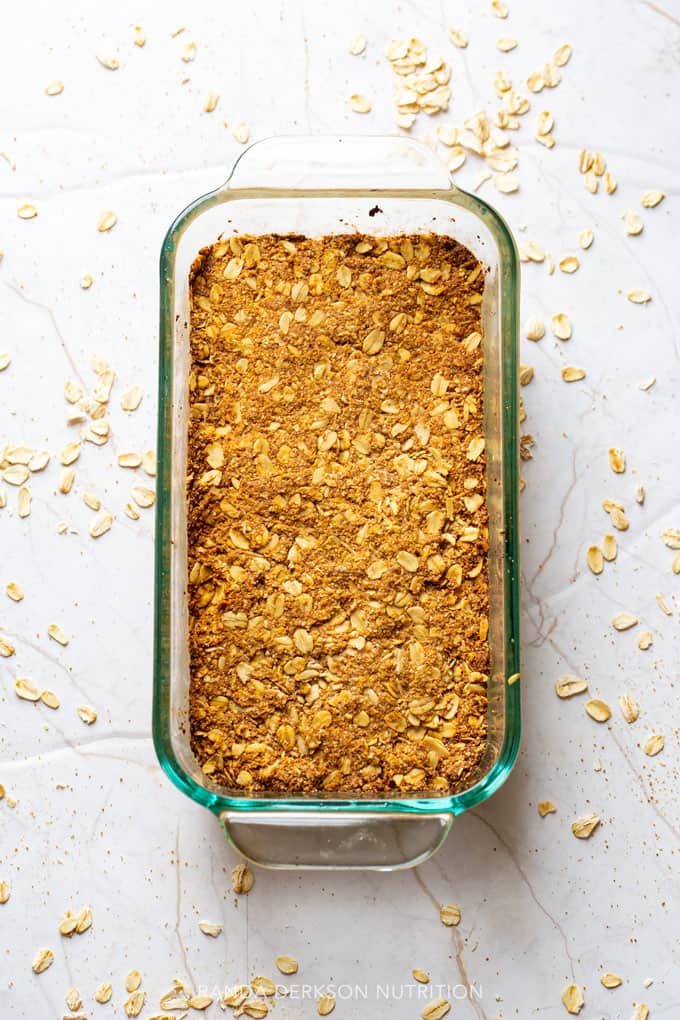 healthy pumpkin granola bars pressed into a loaf pan