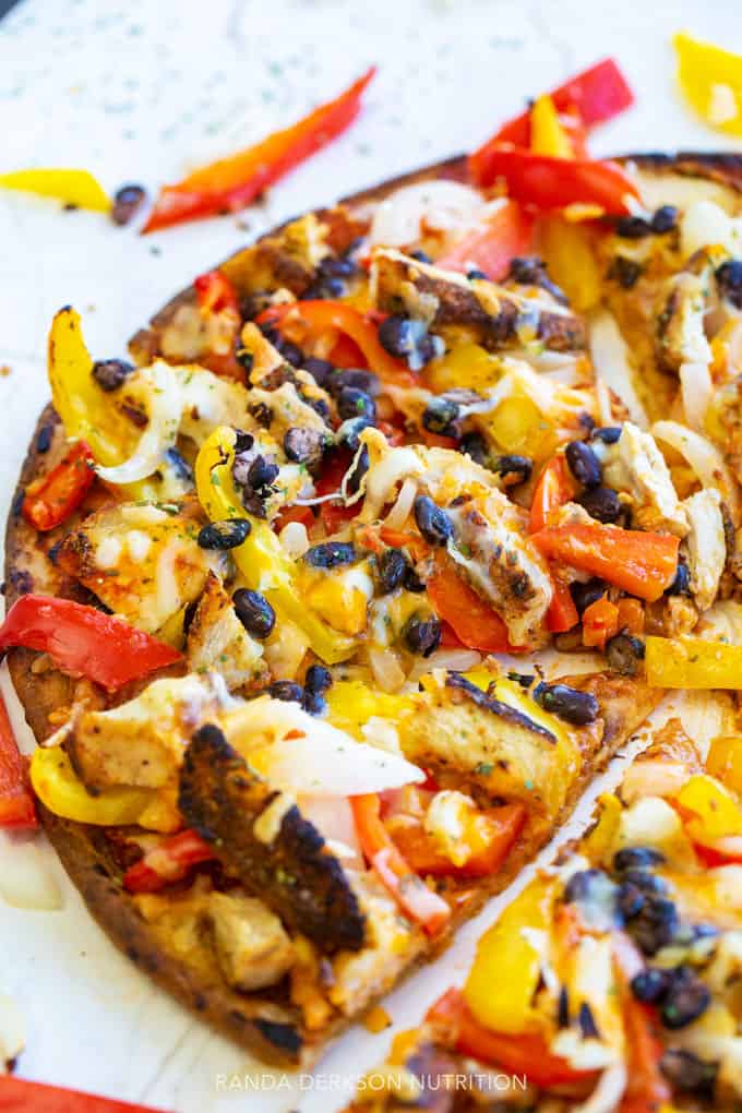 close up of peppers and onions on a chicken pizza on a cauliflower crust