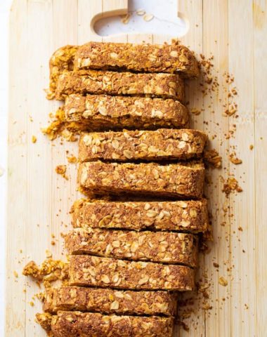 healthy pumpkin breakfast bars sliced on a cutting board
