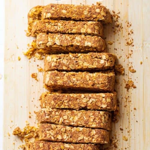 healthy pumpkin breakfast bars sliced on a cutting board