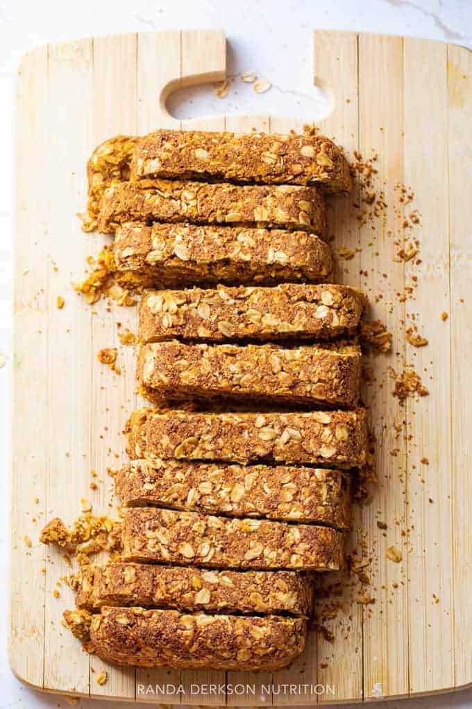 healthy pumpkin breakfast bars sliced on a cutting board