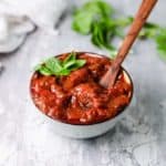 healthy tomato sauce in a bowl with basil