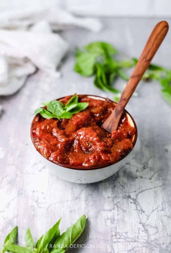 healthy tomato sauce in a bowl with basil