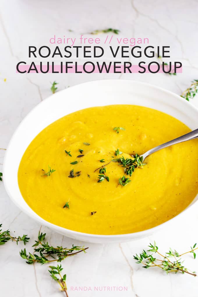 roasted cauliflower soup in a white bowl garnished with chopped chives  pinterest image