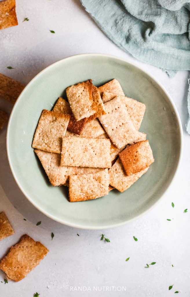 gluten free crackers in a green bowl