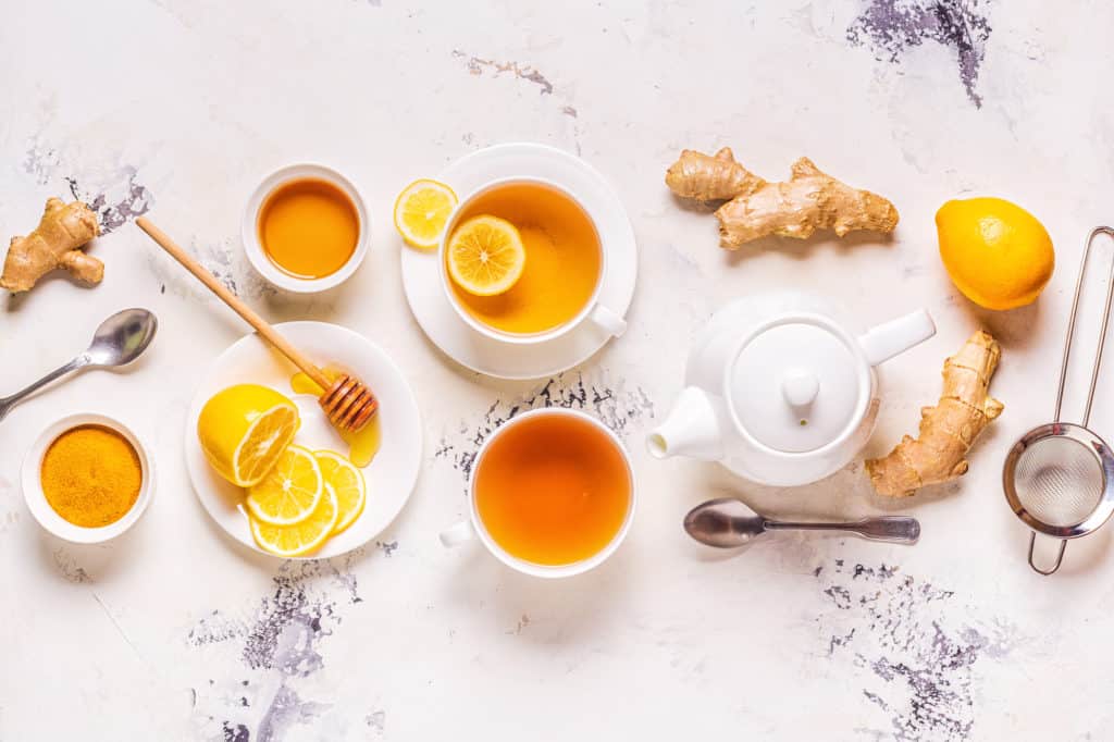 heartburn teas on a white background with lemon and ginger