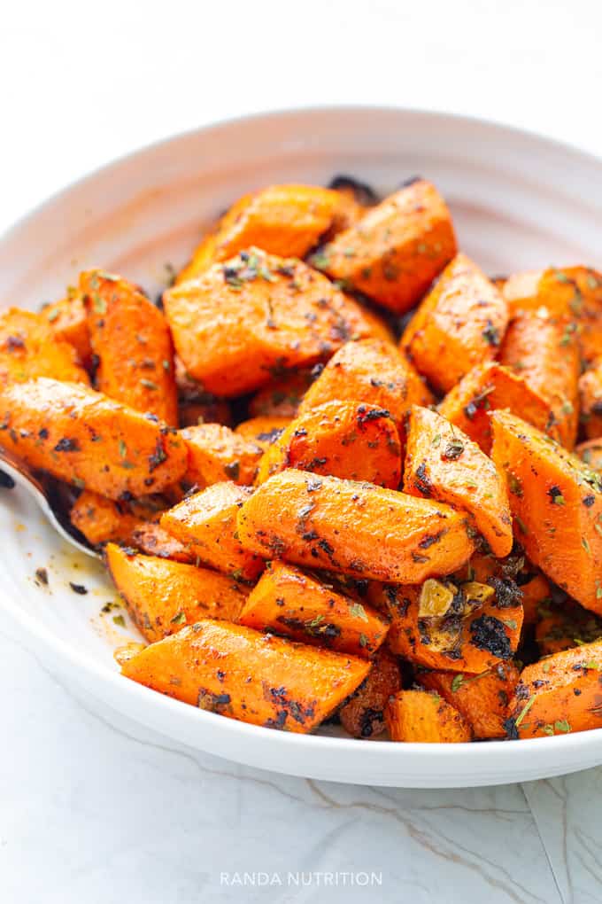 roasted carrots with spices sliced in a bowl