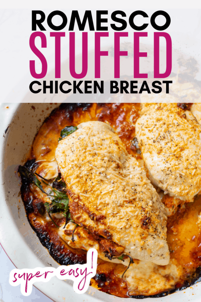 closeup of these Romesco Stuffed Chicken Breasts in a white casserole dish pinterest image