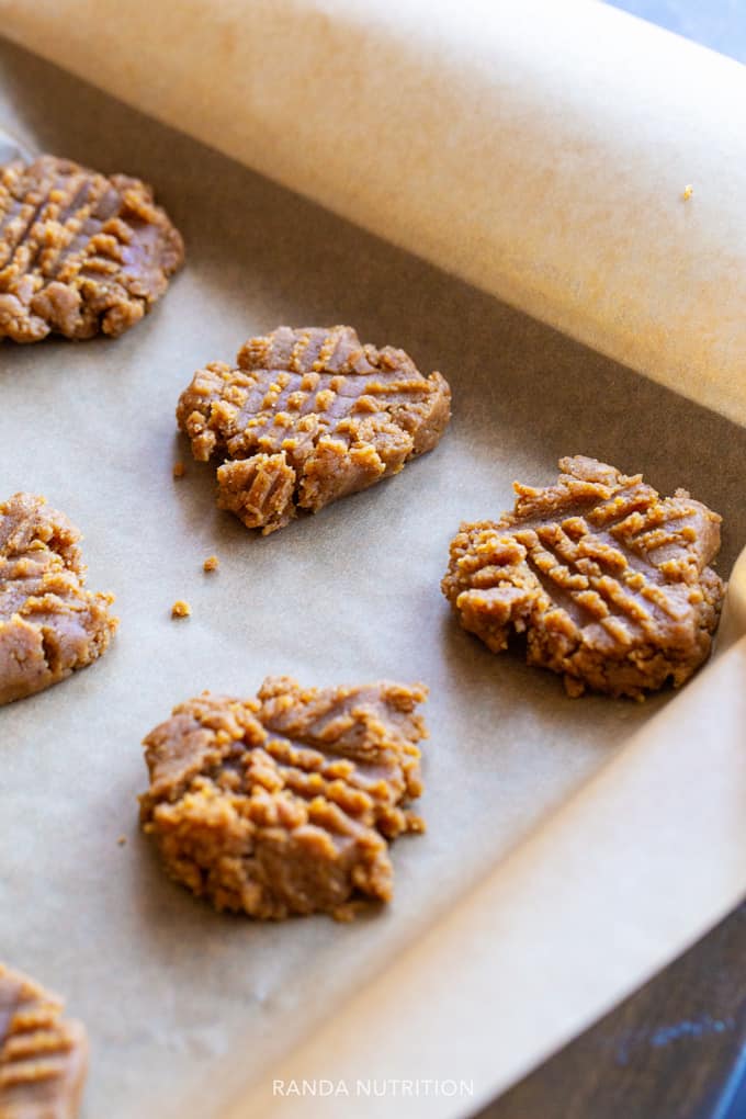 blender cookies on a parchment lined baking sheet