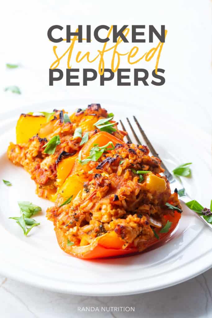 healthy chicken stuffed peppers recipe on a white plate with chopped cilantro