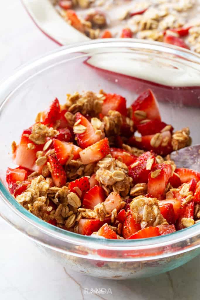 fresh strawberries and rhubarb tossed with coconut sugar, oats, cinnamon, and coconut oil