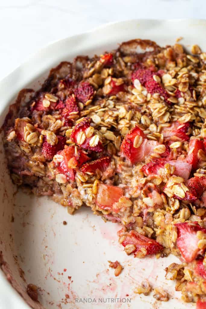 Two pieces of baked oatmeal missing out of a baking pan.