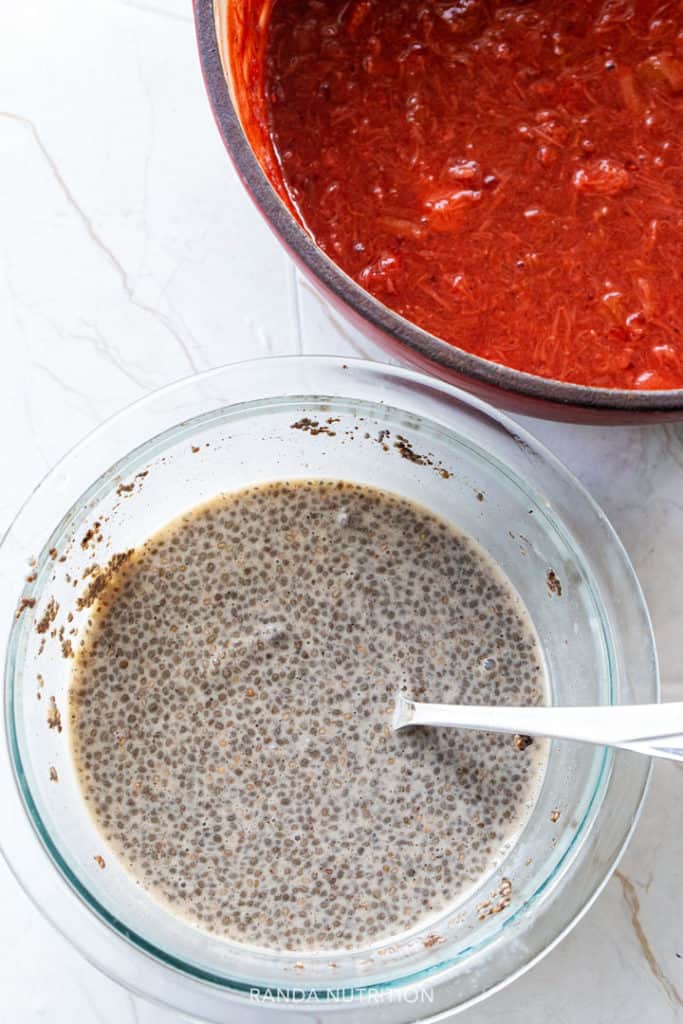 ingredients for chia seed pudding: chia seeds and strawberry rhubarb sauce
