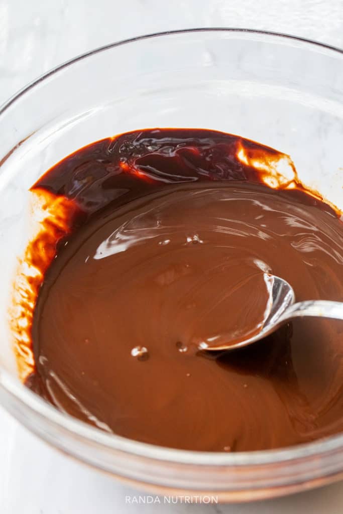 melted dark chocolate with coconut oil in a bowl 