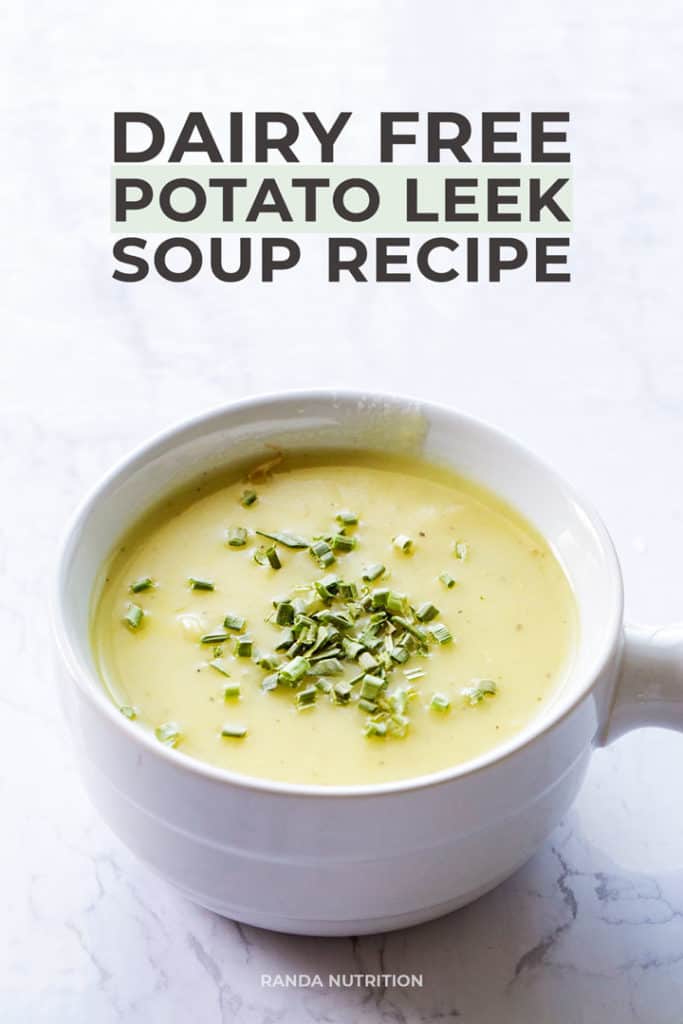 dairy free potato leek soup recipe in a white bowl garnished with chopped chives