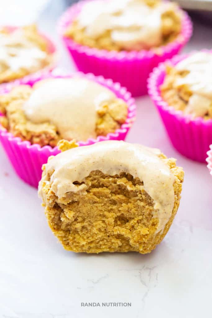 moist pumpkin spice muffins with pumpkin yogurt frosting