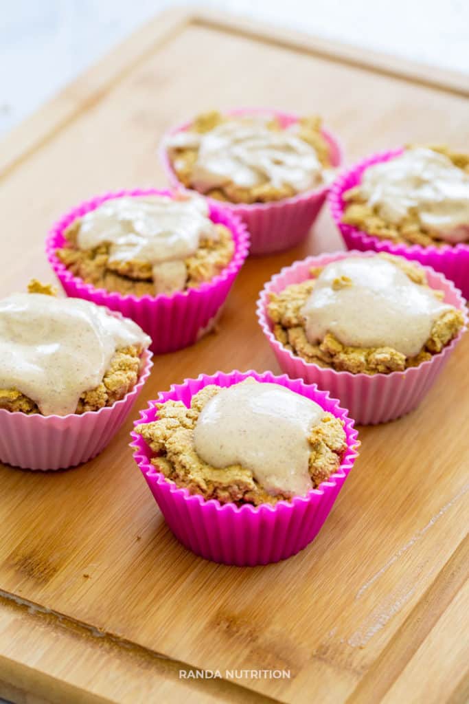 pumpkin spice muffins on a cutting board, cooling