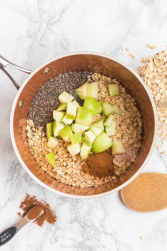 chia seed, apples, rolled oats, cinnamon, maple syrup, vanilla extract in a sauce pan