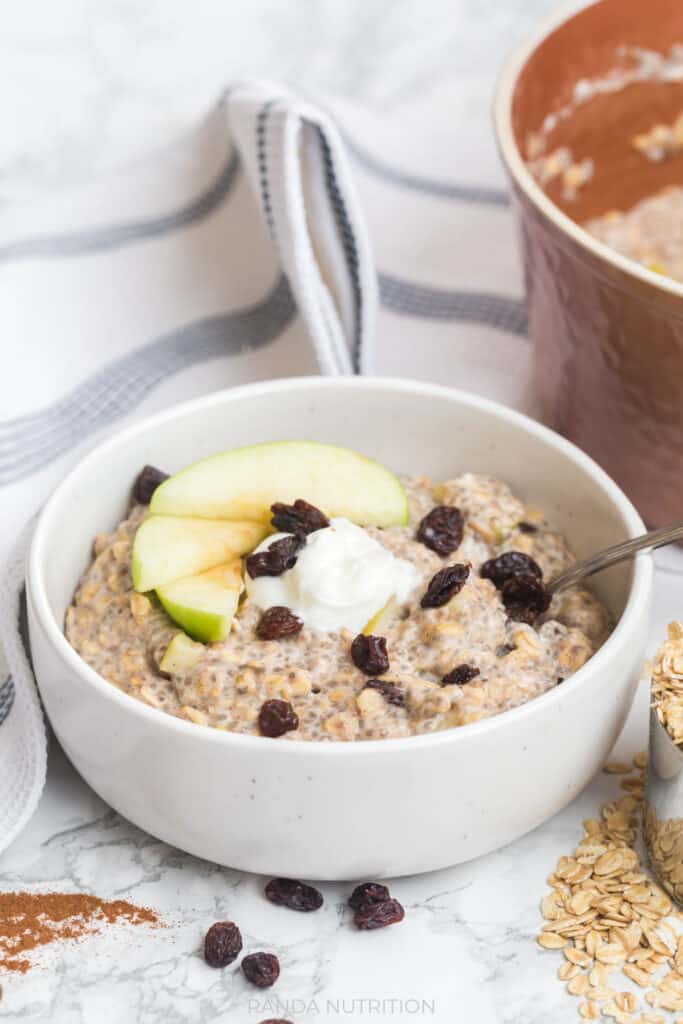 side shot of breakfast oatmeal with fruit, raisins, and greek yogurt