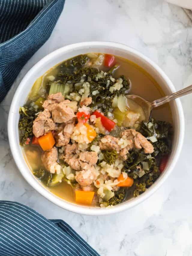 kale and sausage soup in a bowl