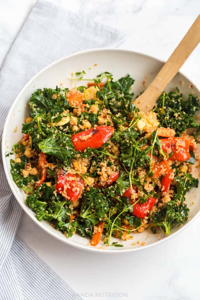 tossed kale and quinoa salad with roasted vegetables