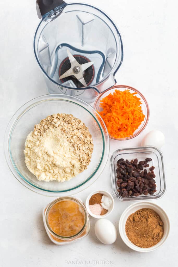 ingredients needed to make carrot muffinsThis recipe for moist, healthy carrot cake muffins is so easy because they're blender muffins. Easy clean up and gluten free, makes these recipes suitable for any diet and they're easy to make vegan.