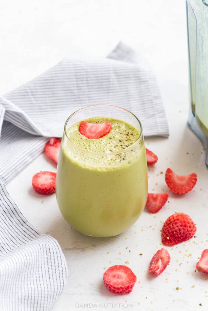 Kid-friendly Strawberry Spinach Smoothie combines frozen strawberries, fresh spinach and yogurt to make an easy, healthy, and delicious green smoothie recipe.