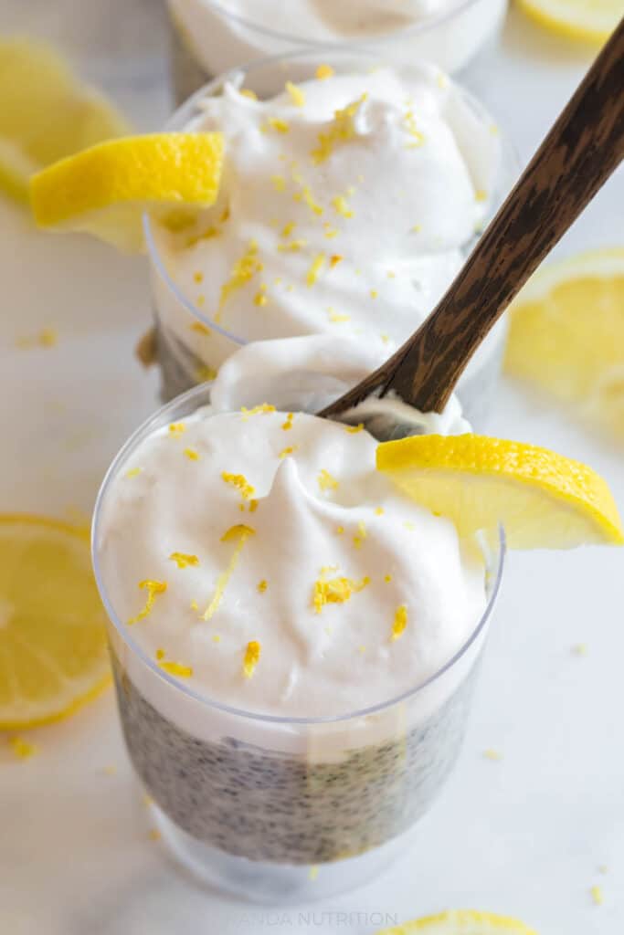 lemon chia seed pudding topped with coconut whipped cream