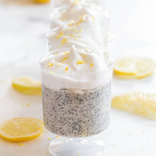 lemon slices along chia pudding topped with coconut whip cream