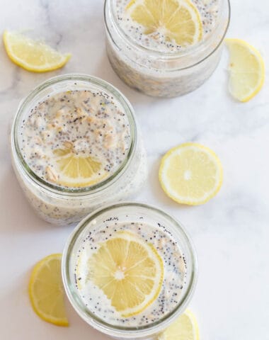 slices of lemon in mason jars with overnight oats being made