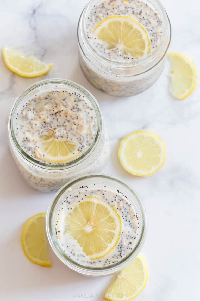 slices of lemon in mason jars with overnight oats being made