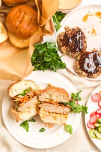 banh mi burger on a table spread with brioche buns