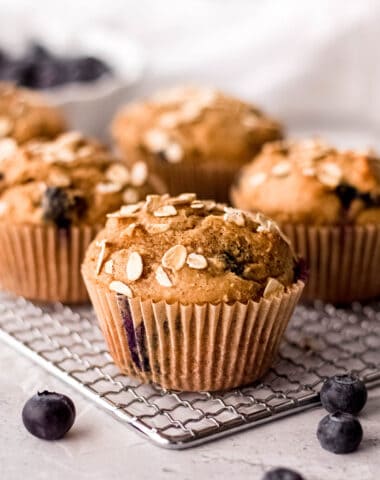 blueberry protein muffins on a cooling rack
