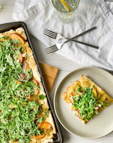 Grilled peach and prosciutto pizza on a sheet pan