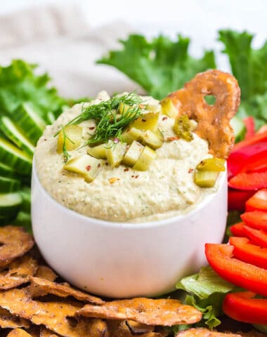 dill pickle hummus with pretzel chips and vegetables