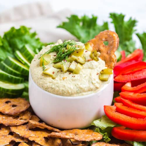 dill pickle hummus with pretzel chips and vegetables