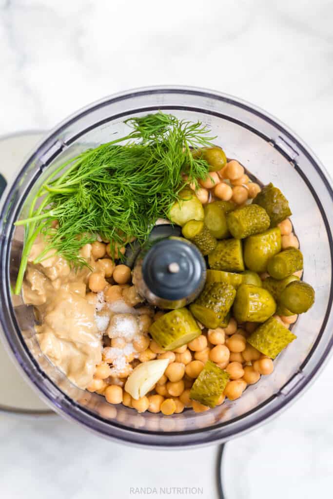 ingredients to make homemade hummus variations in a food processor
