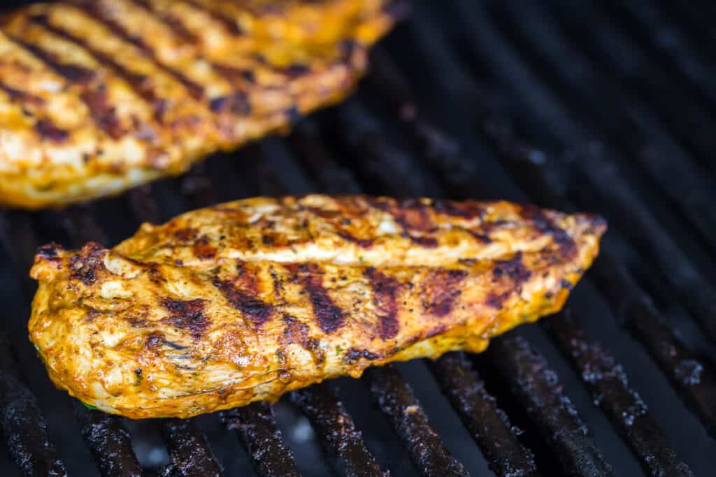 chicken breast being killed on the grill