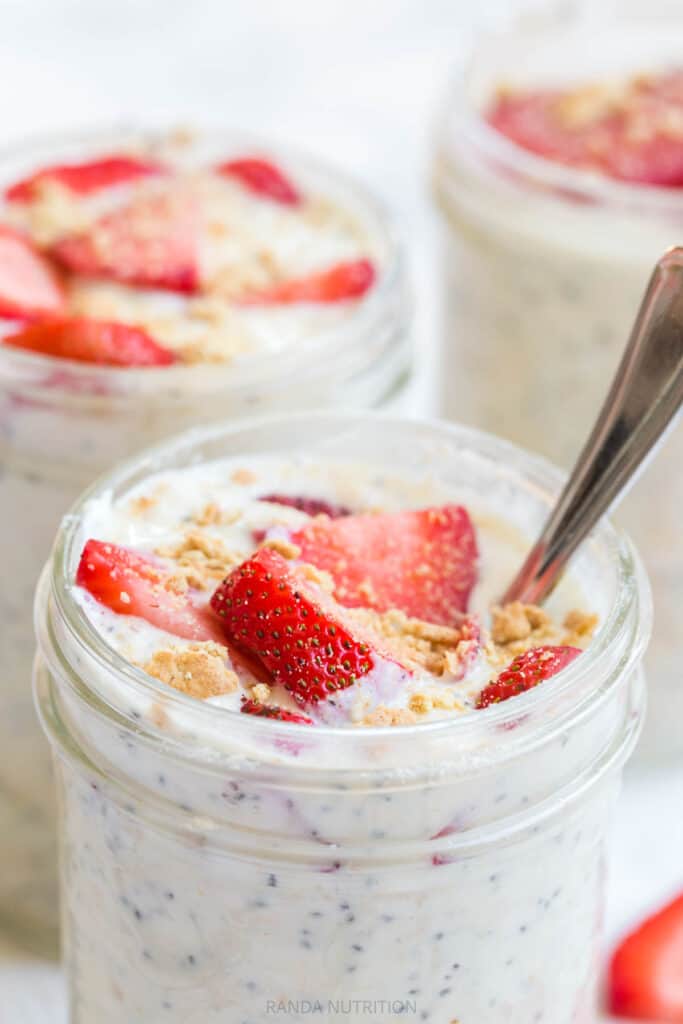 chia seeds in yogurt with strawberries in a mason jar