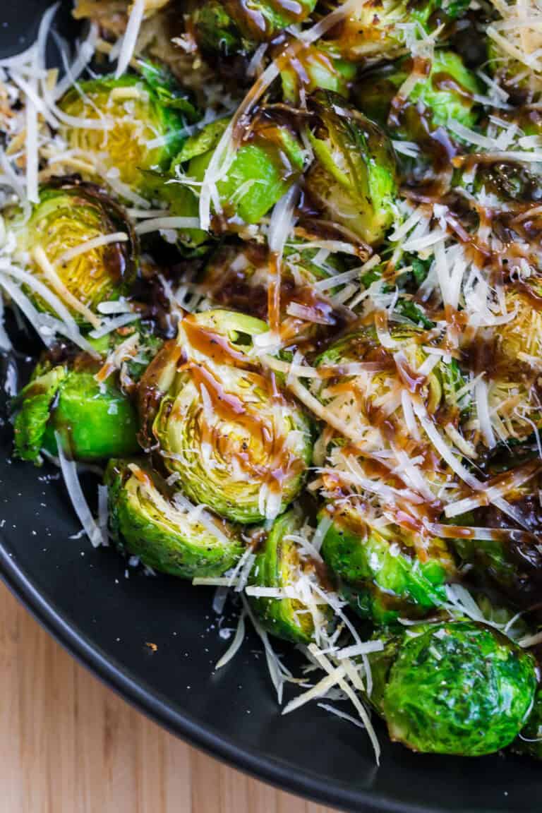 air fryer brussels sprouts topped with parmesan and balsamic