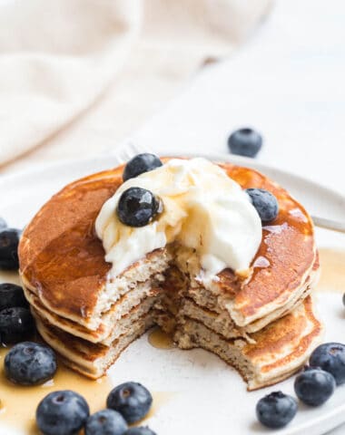 protein cottage cheese pancakes topped with blueberries and greek yogurt