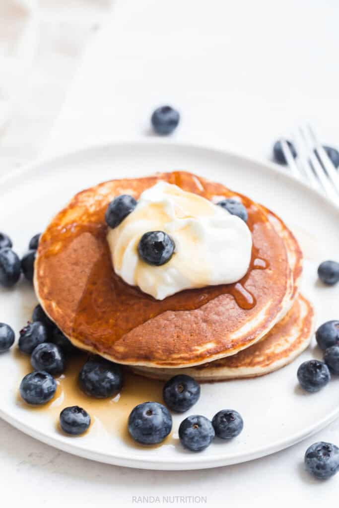 golden hot cakes topped with sugar free syrup and greek yogurt