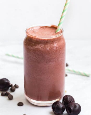 chocolate cherry smoothie with a green straw