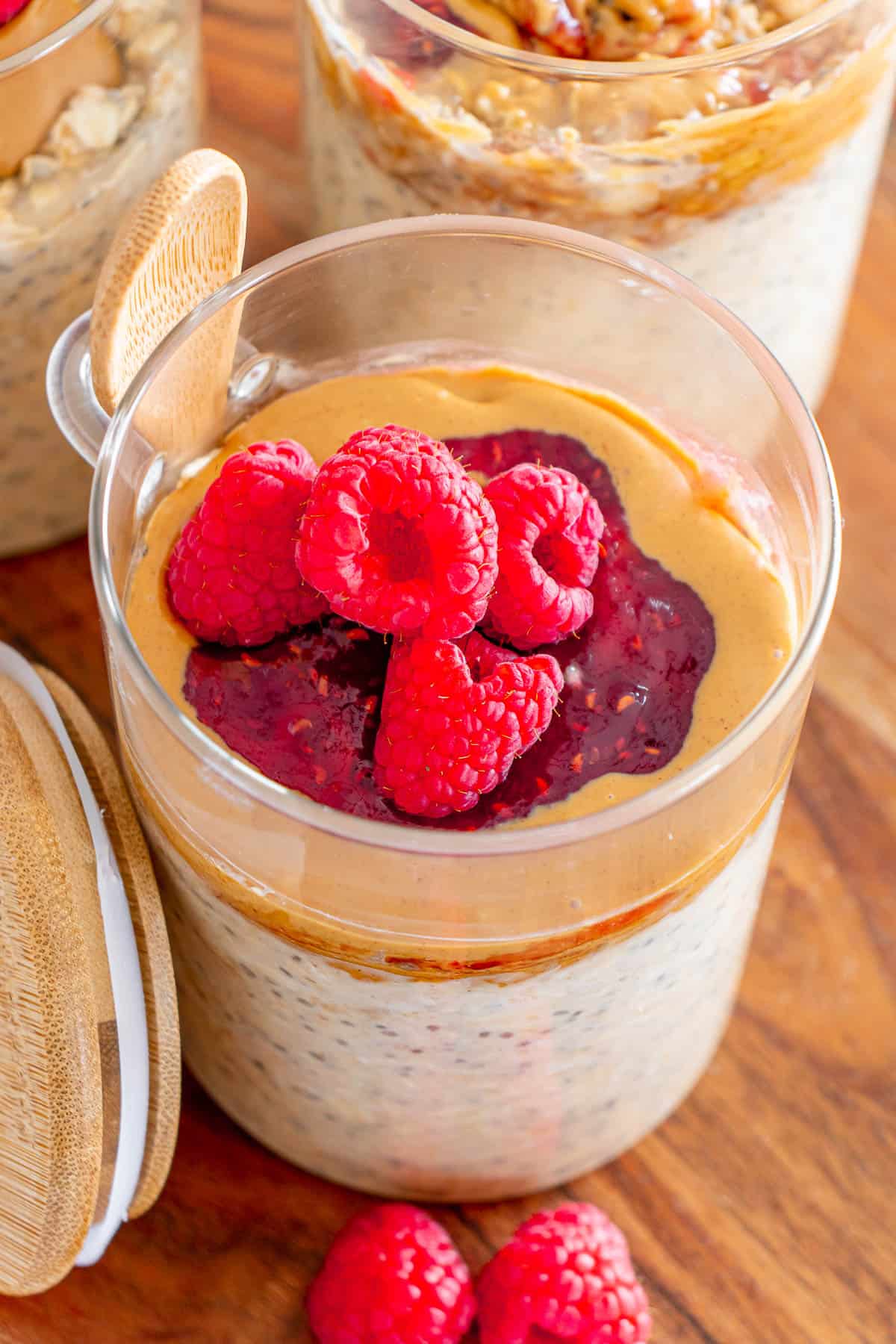 raspberry peanut butter and jam overnight oats in a glass meal prep jar